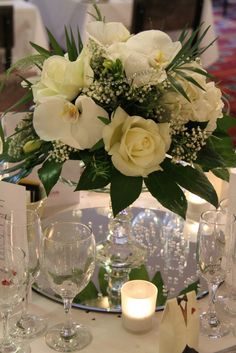 Centerpiece 104 - White rose , Gypsophila, Palm Leaves and Orchid . . . more