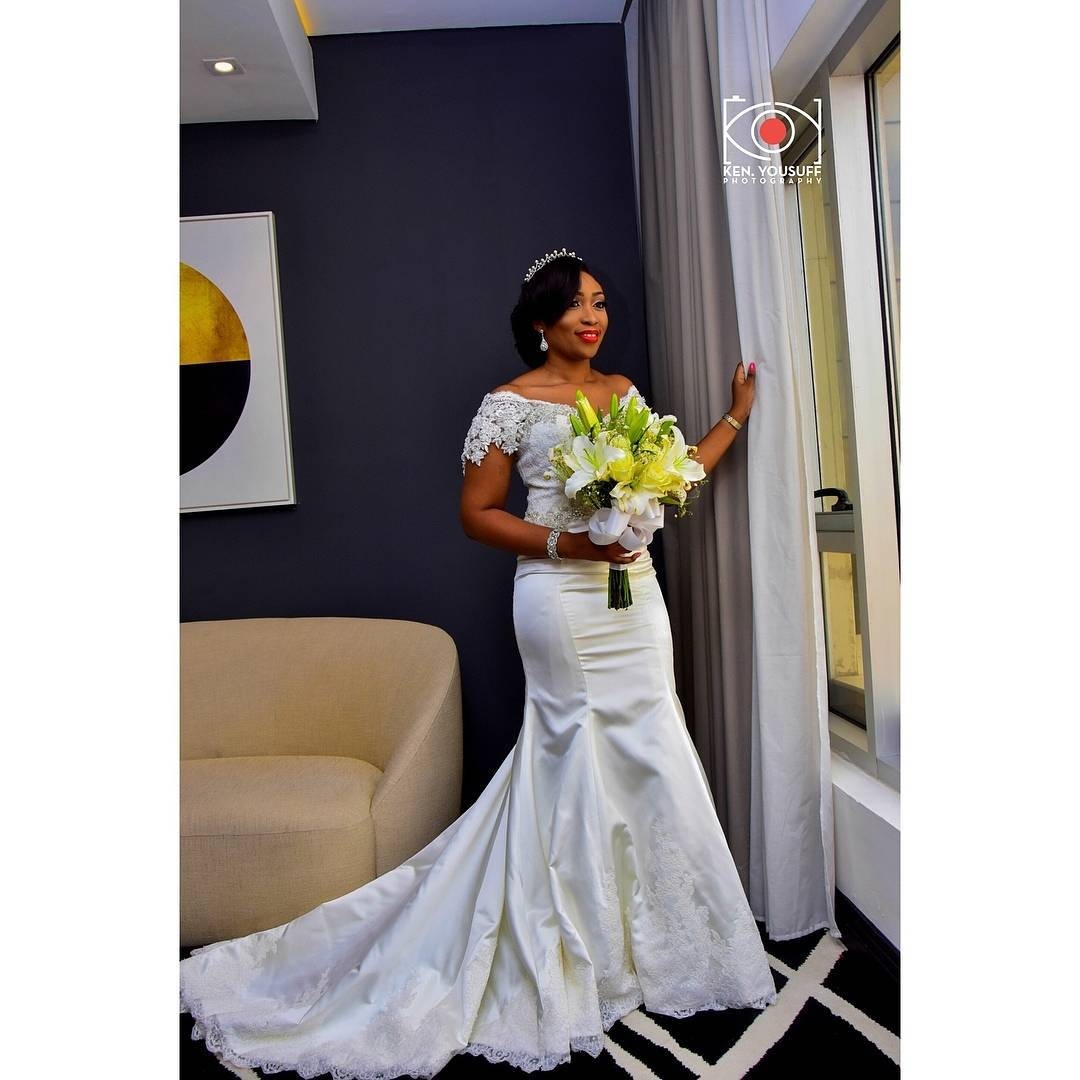 BRIDAL BOUQUET 119 - (White Calligraphy by Regal) white roses, lilies and gypsophila (million star) flowers . . .
