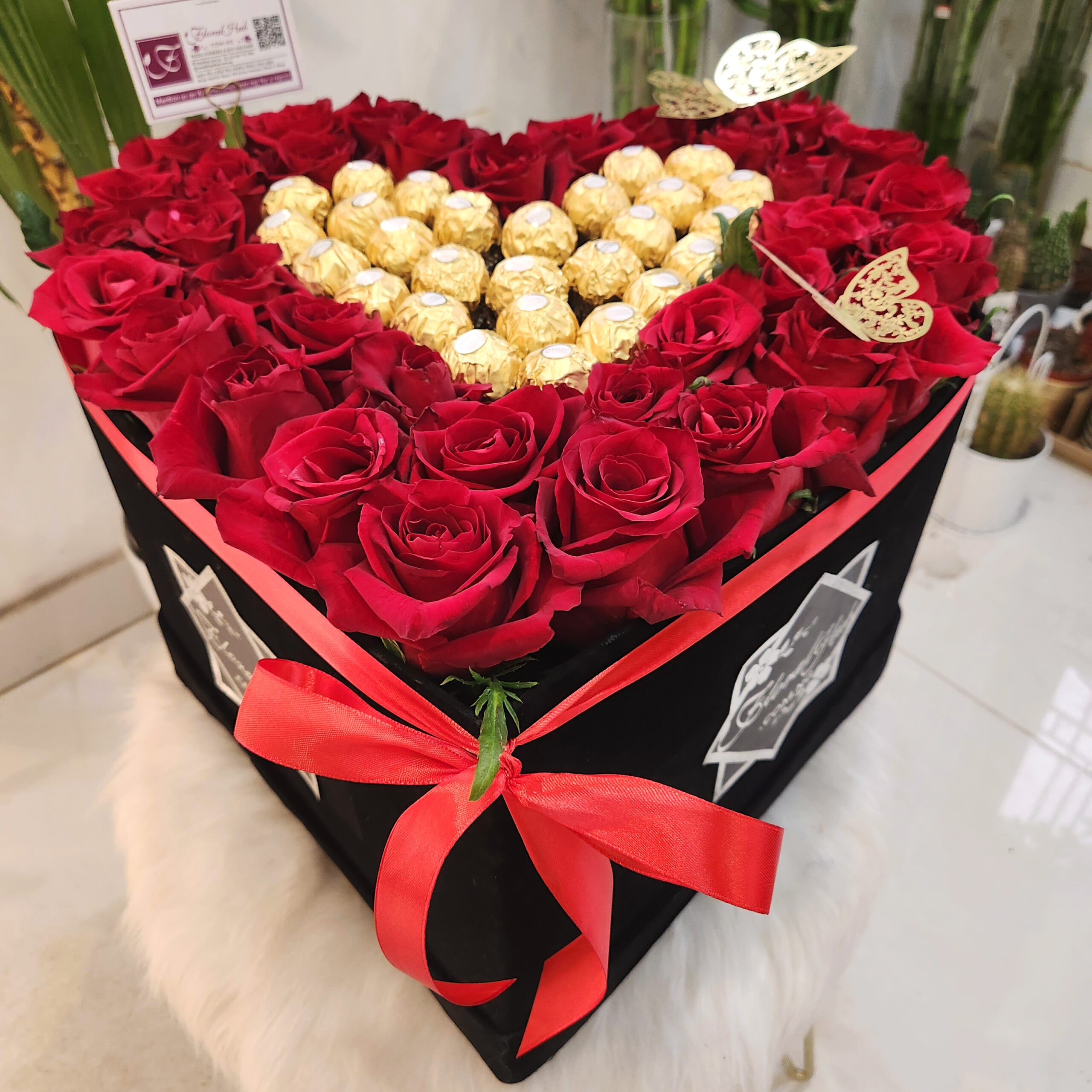 VIP Classic Roses and Chocolate - Elegant mix of Fresh cut Roses centered with luxurious Ferrero Rocher chocolates
