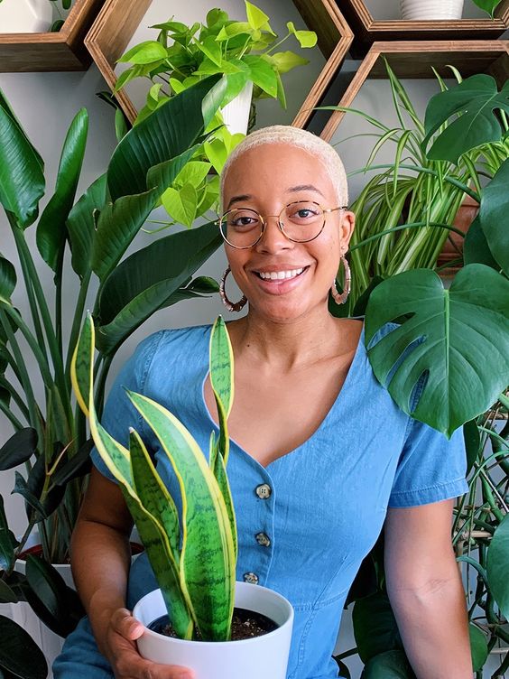 Happy female plant owner